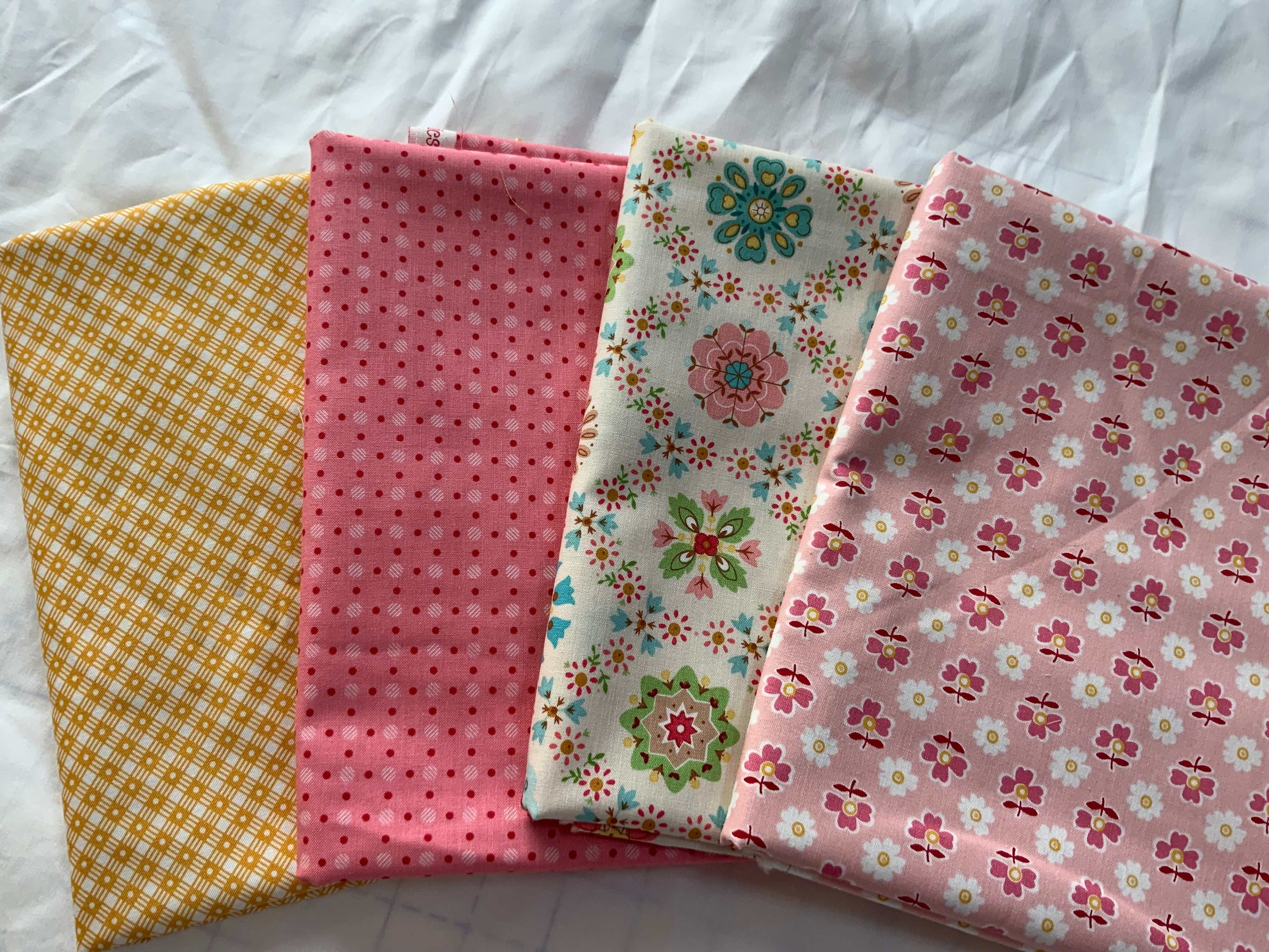 Four one-yard fabric pieces in floral and patterned designs for 4-YARD QUILT