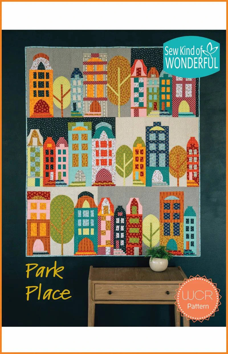 Park Place Quilt Pattern featuring colorful pieced houses and trees in Sew Kind of Wonderful design