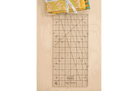 Quick Straight Ruler™ SKW-QSR by Sew Kind of Wonderful with angled slot and square dot grids for precise fabric cutting and squaring.