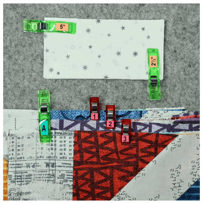 Reusable organizing stickers on fabric clips in multiple colors for marking sizes and steps in patterns