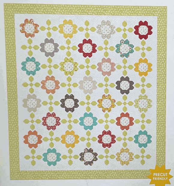 Garden Melody Quilt Kit with colorful floral patchwork and green border, 68x76 inches.