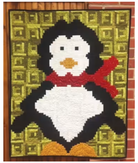 Waddles from Cut Loose Press quilt pattern featuring whimsical penguin with 4-inch log cabin blocks