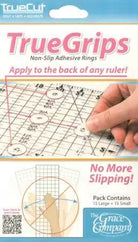 TrueGrips non-slip adhesive rings on rulers by TrueCut for safe and accurate cutting