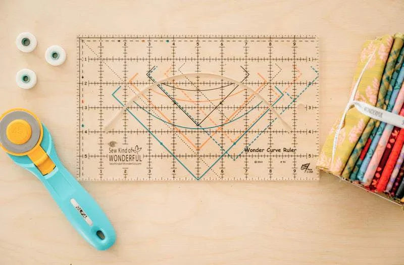 Wonder Curve Ruler sewing tool with colorful curved markings for quilting and fabric cutting.