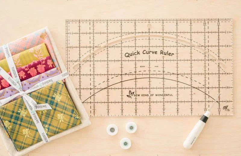 Quick Curve Ruler™ by Sew Kind of Wonderful acrylic quilting ruler with curved cut-out and grid lines for precise curved shape cutting and block squaring
