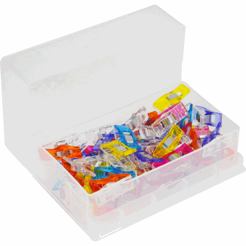 Assorted colorful Wonder Clips holding fabric layers for sewing and crafts with seam allowance markings