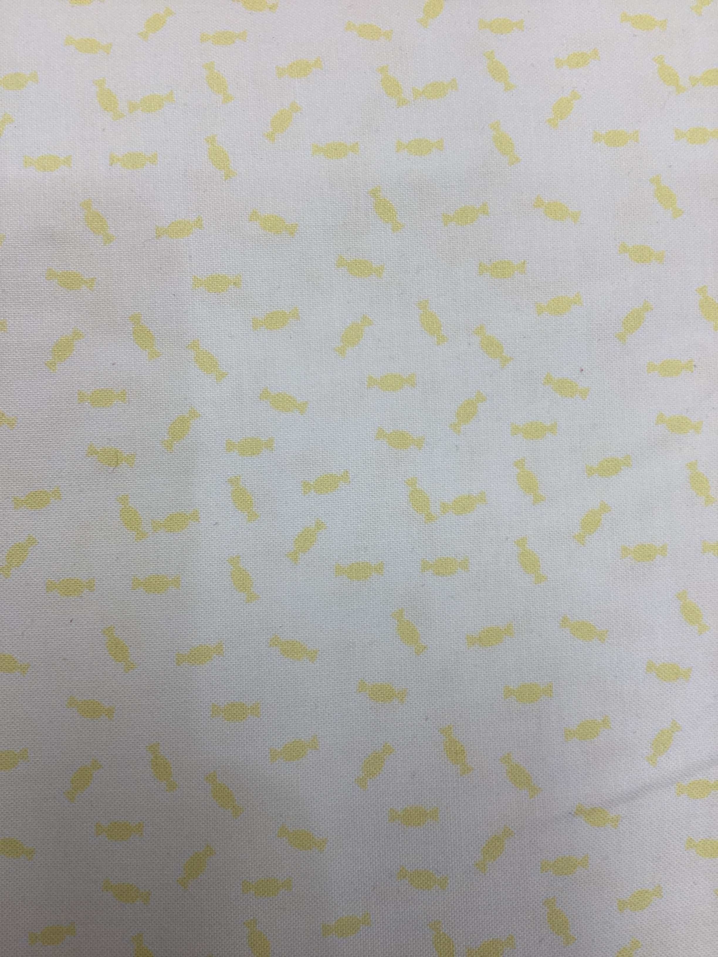 4 1/2 yard quilt backing fabric with yellow candy pattern on white background