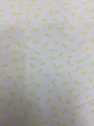4 1/2 yard quilt backing fabric with yellow candy pattern on white background
