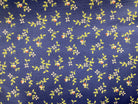 3 Yard Backing fabric with small yellow and orange floral pattern on blue background for quilt backings