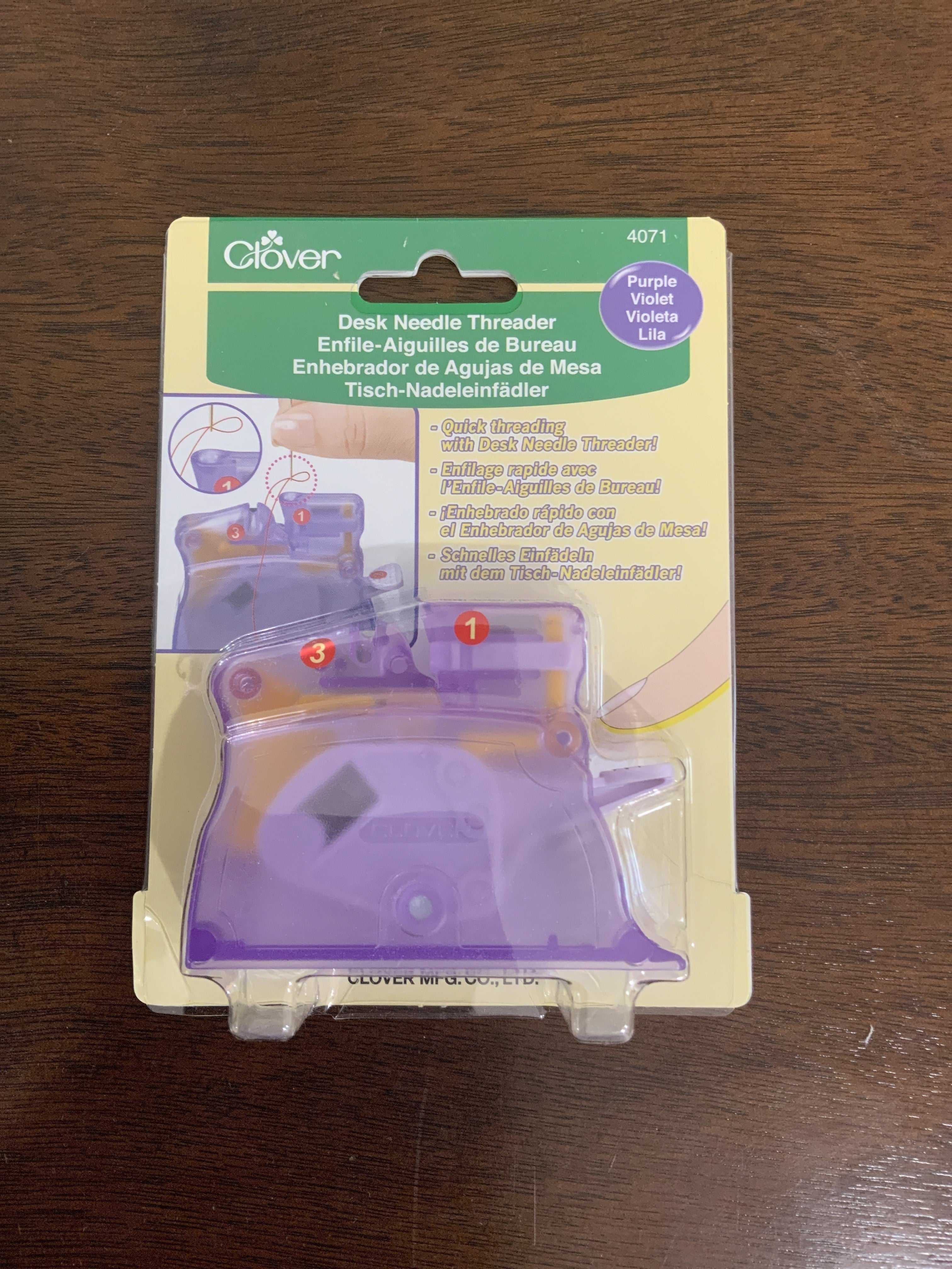 Purple Clover Desktop Needle Threader in packaging for threading thick and fine needles