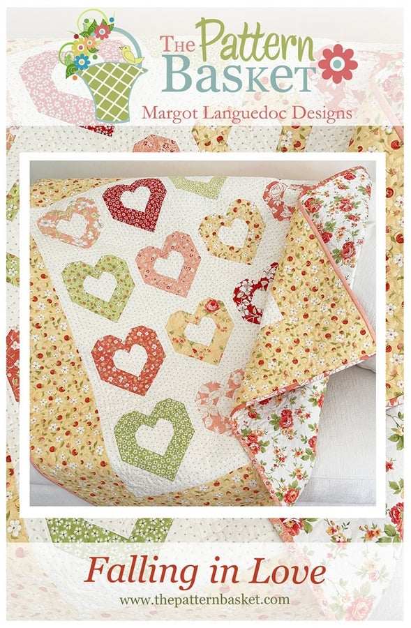 Falling in Love Quilt Pattern with heart motifs and floral fabric, finished quilt size 53.75 x 56.75 inches