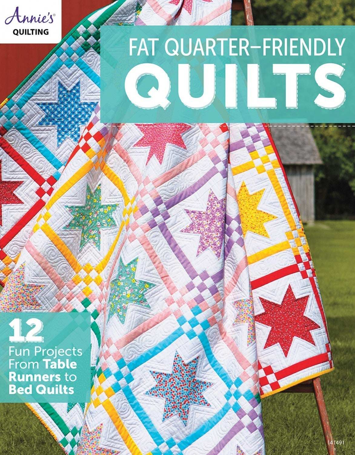 Colorful fat-quarter friendly quilts with star patterns displayed outdoors