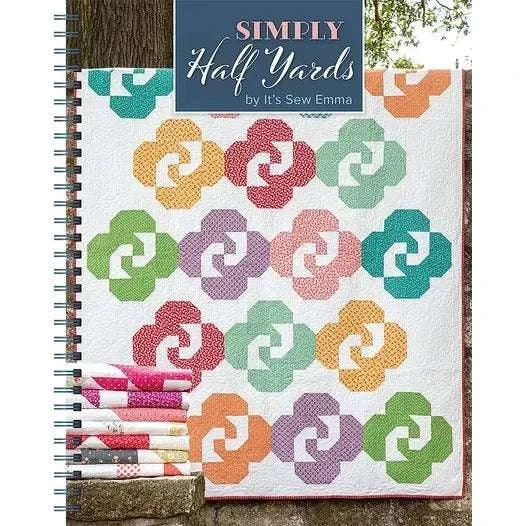 Simply Half Yards quilt book by It's Sew Emma with colorful quilt patterns and folded fabrics