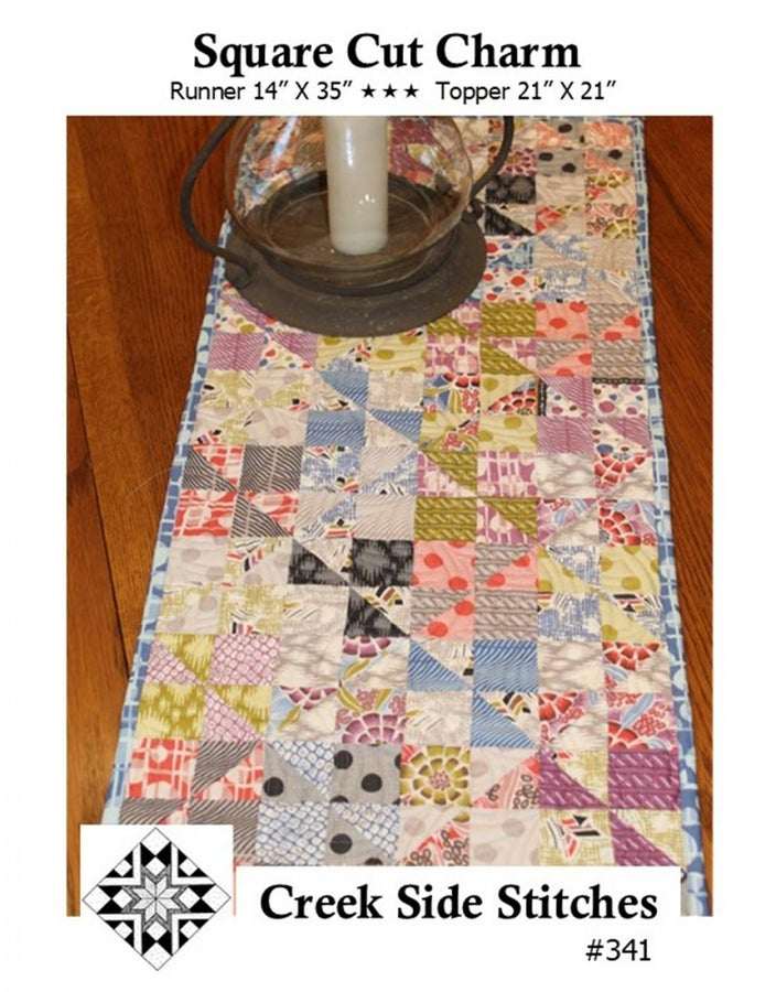 Square Cut Charm pattern table runner with multicolored patchwork design by Creek Side Stitches