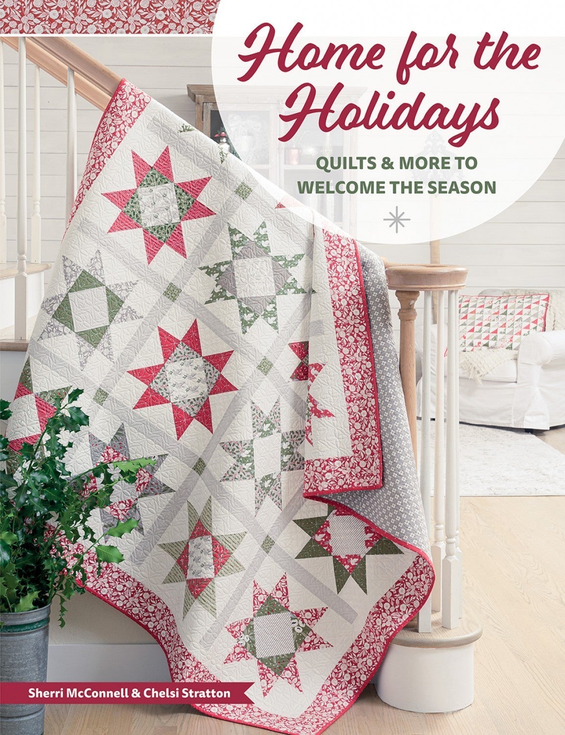 Festive quilt with red and green star patterns draped over staircase railing for Home for the Holidays decor