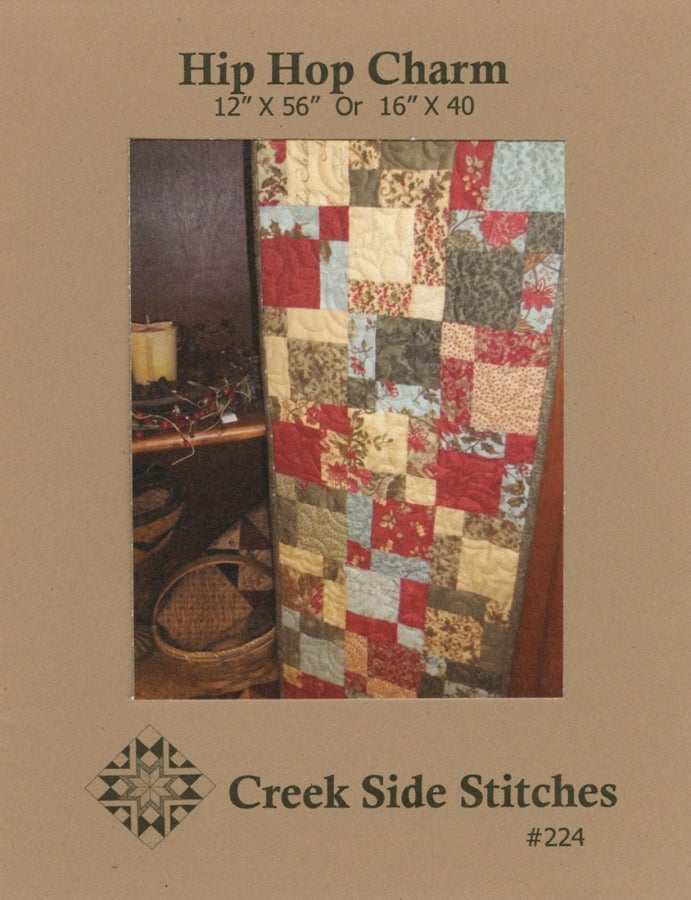 Hip Hop Charm table runner quilt pattern in warm autumn colors by Creek Side Stitches